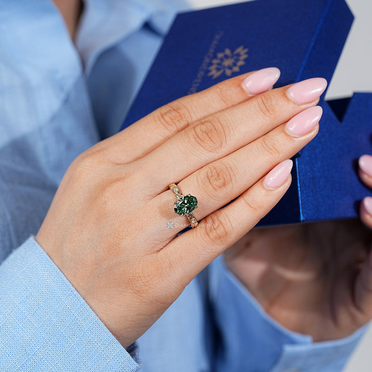 Handmade oval engagement ring with milgrain details and hidden diamonds.