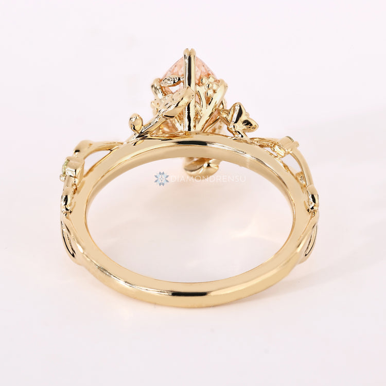 Handmade marquise diamond ring with pink center stone.