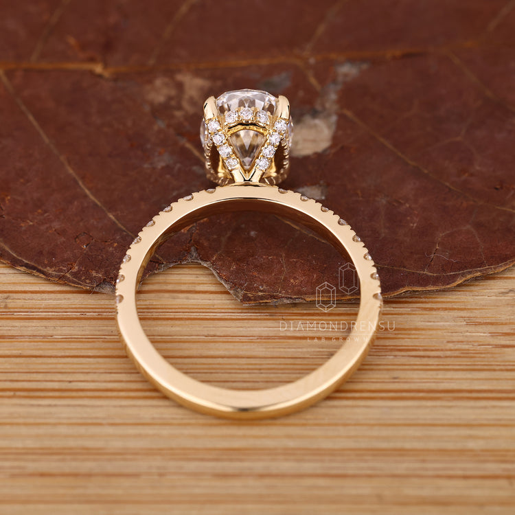 IGI certified oval cut ring with hidden halo and round cut accents.