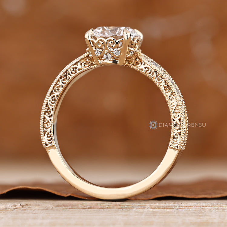 Round cut diamond ring with four claw prong setting.