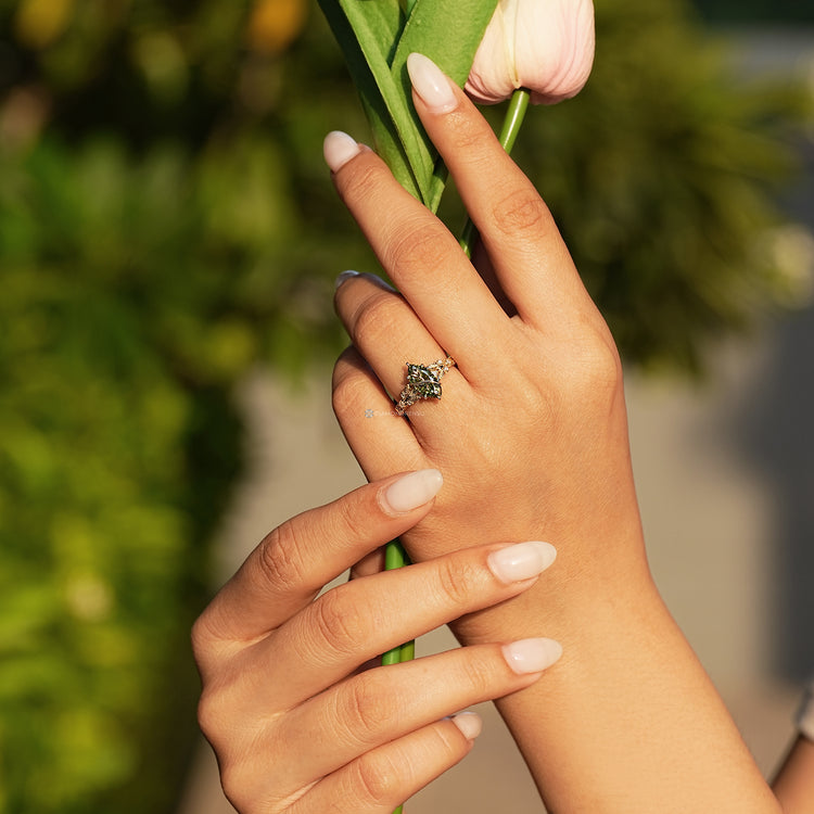 Marquise ring with ornate vintage scrollwork shank and milgrain details.