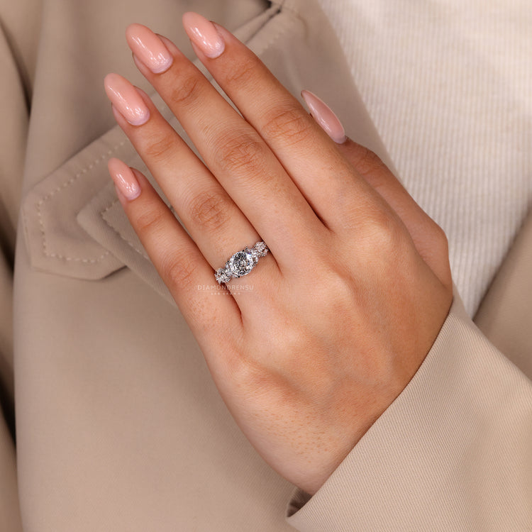 Handmade vintage ring with a Portuguese cut diamond and twisted pave band.