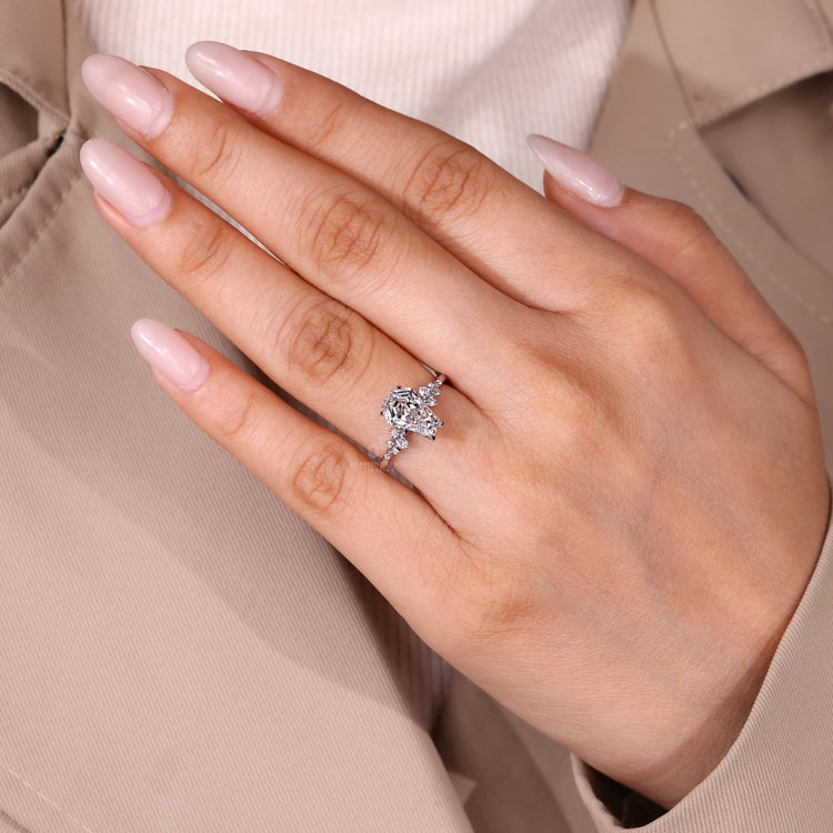 Coffin diamond ring with tulip setting and hidden diamond accents.