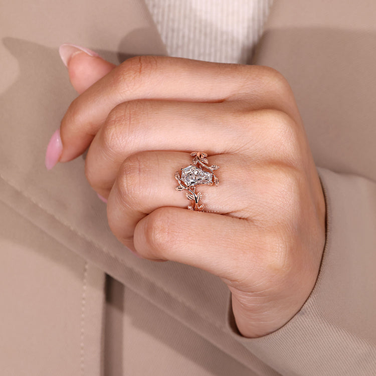 Nature inspired coffin engagement ring with six claw prong setting.