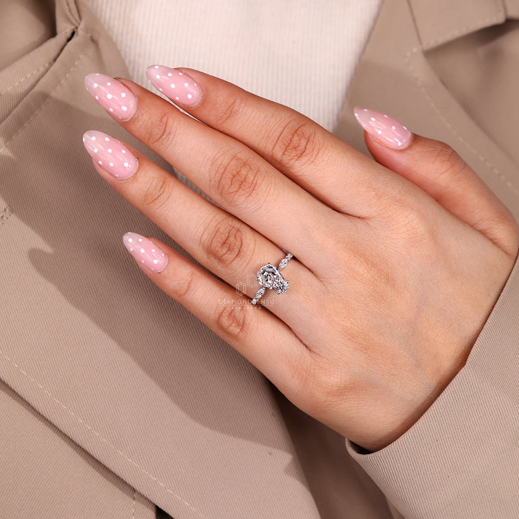 Coffin shaped engagement ring with pave band and basket setting.