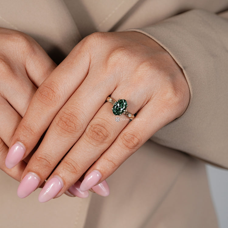 Oval engagement ring with hidden diamonds and round side stones.