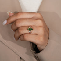Nature inspired engagement ring with filigree details.