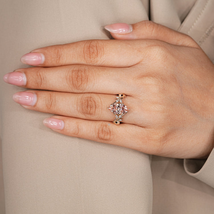 Nature inspired lab grown diamond ring with round and marquise side stones.