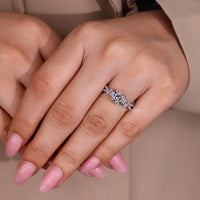 The twisted pave enhances this cushion center stone setting.
