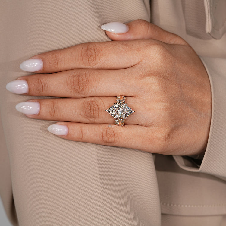 Dutch marquise engagement ring with marquise side stones and round stones.