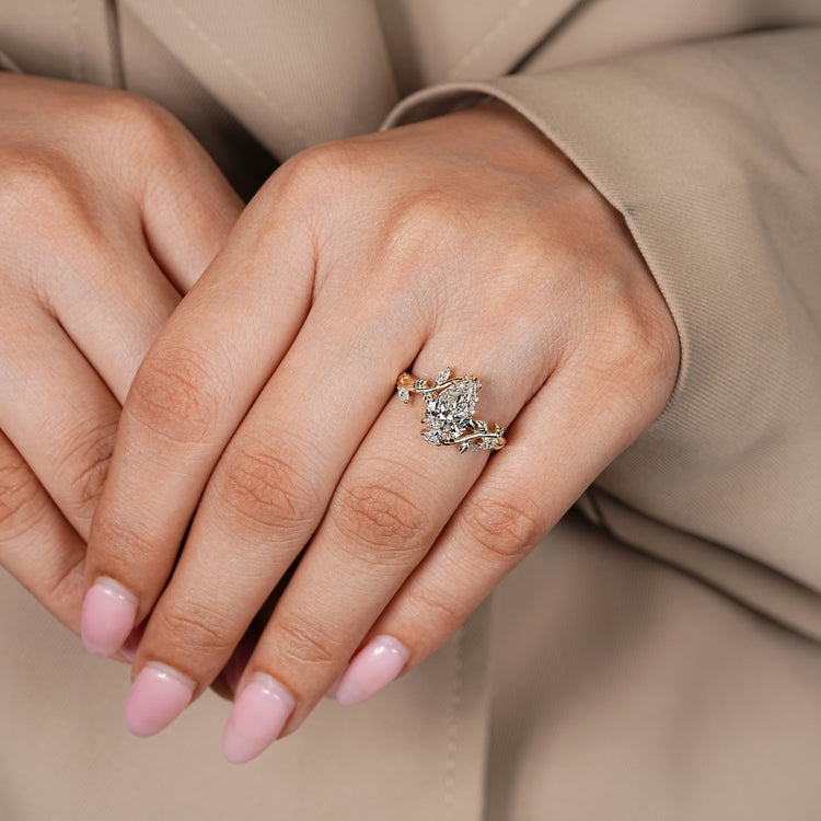Lab grown pear diamond ring with bypass setting.