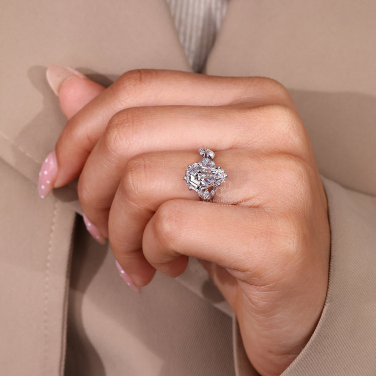 Lab grown diamond ring with coffin center and cluster accents.