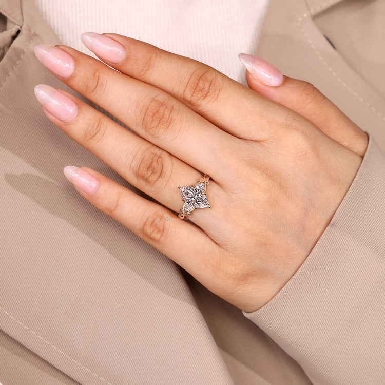 Seven stone engagement ring with marquise and round diamonds.