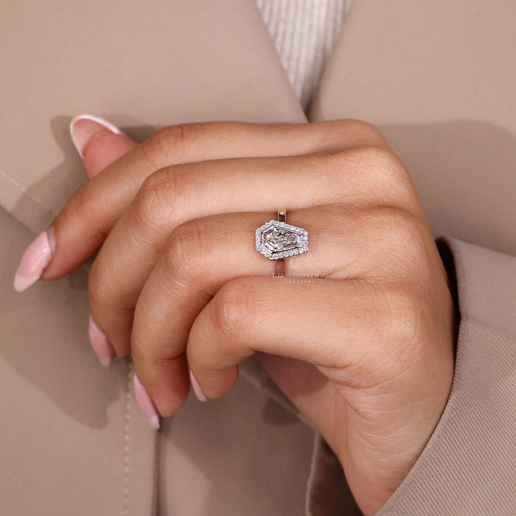 Round halo engagement ring with open gallery design.
