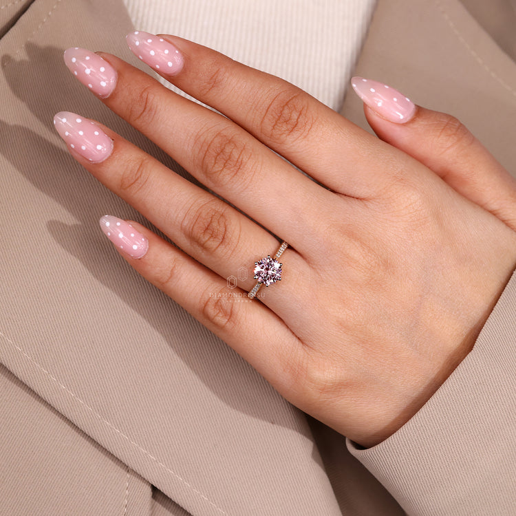 Cathedral setting supports this round diamond ring.