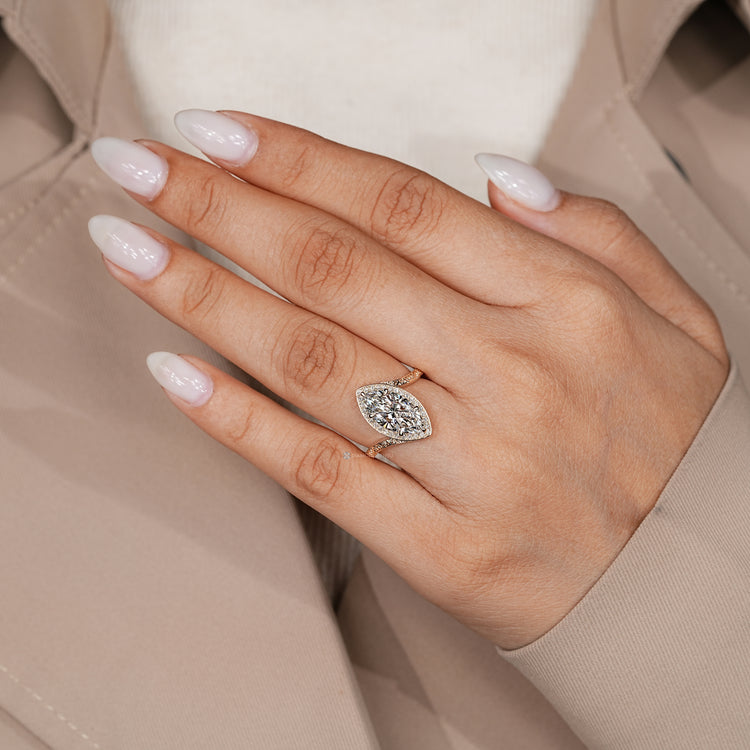 Art deco marquise diamond ring with six claw prongs.