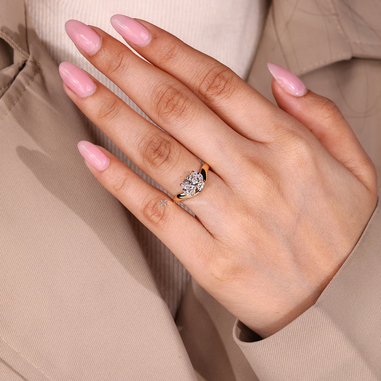 Oval diamond ring with east to west orientation and curved shank.