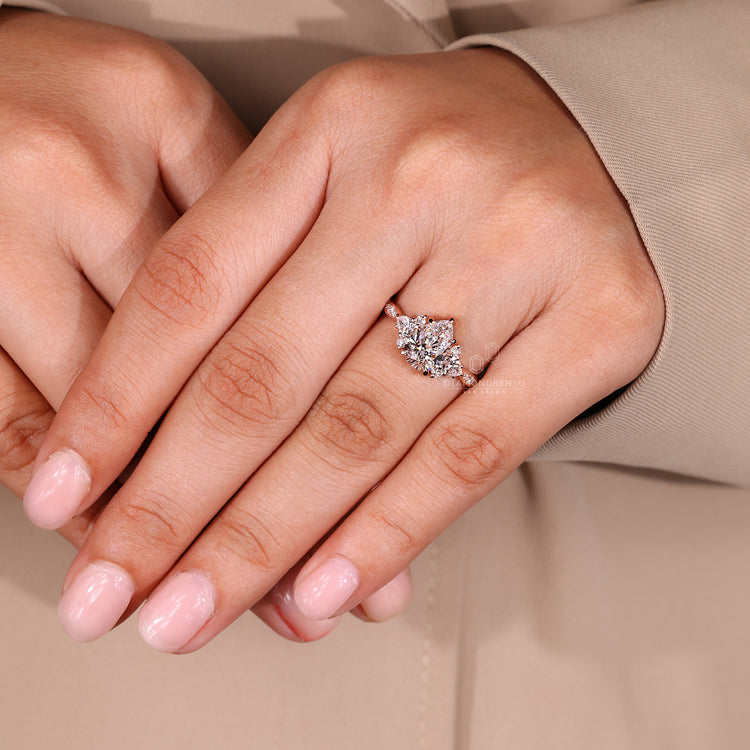 5 claw prong pear cut engagement ring in rose gold.
