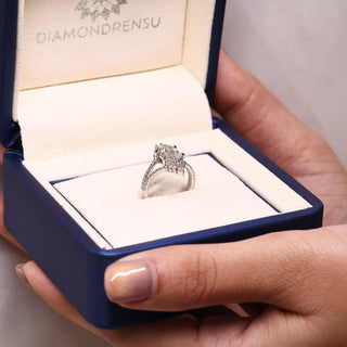 IGI certified elongated hexagon engagement ring with pear and round cut band.
