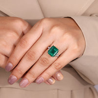 Muse setting emerald engagement ring.
