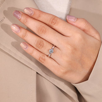 Tapered shank ring with round diamond solitaire and six claw prong.
