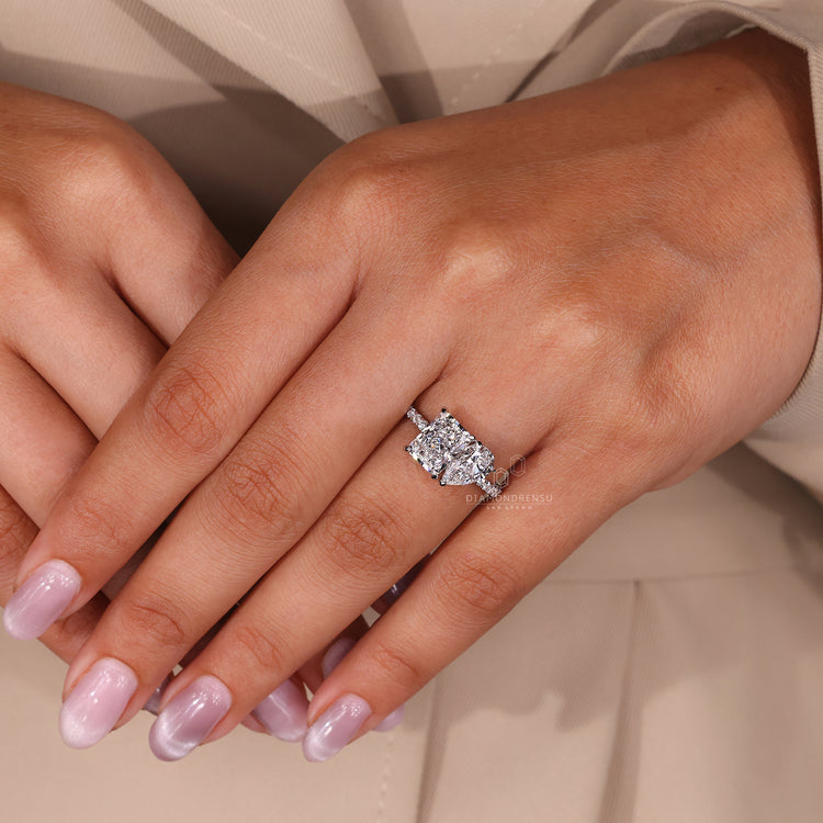Lab-grown diamond engagement ring with pear and radiant diamonds, offering an eco-friendly option.
