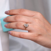 Round cut hidden halo engagement ring handcrafted by Diamondrensu.
