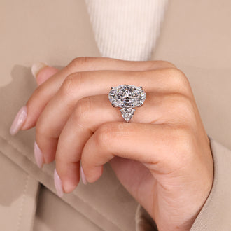 Cathedral setting ring with oval diamond.
