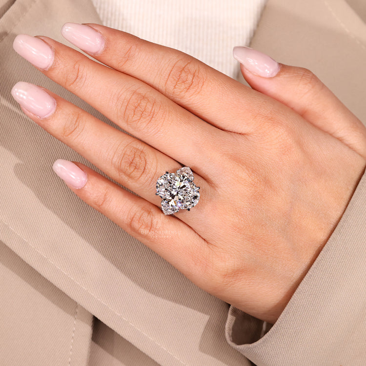 Five stone diamond ring with marquise center.
