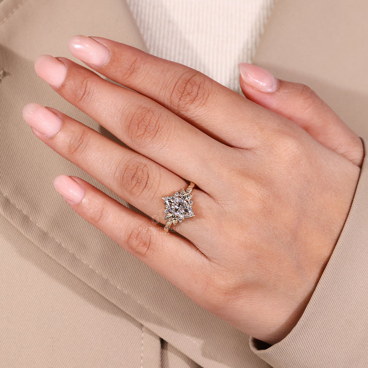 Yellow gold engagement ring with 6 claw prong and nature inspired details.
