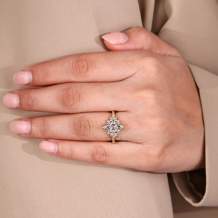 Diamondrensu engagement ring in yellow gold with marquise diamond and side stones.