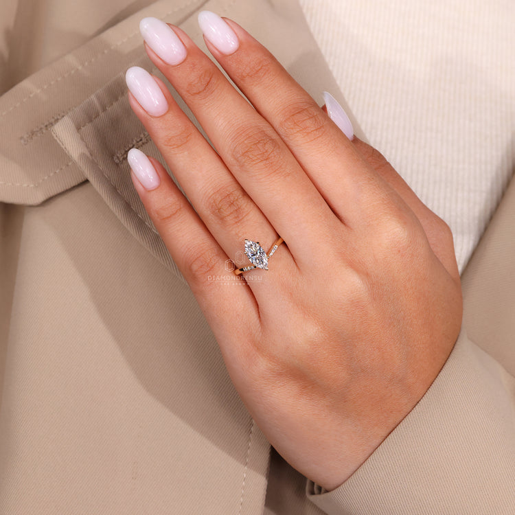 Unique engagement ring crafted with a marquise diamond.
