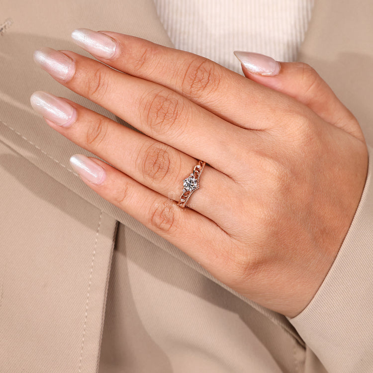 Side diamond ring with round center stone.
