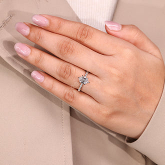 Six claw prong ring holding hexagon diamond securely in place.
