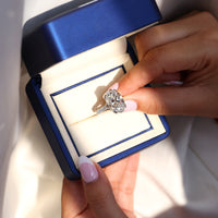 Oval diamond ring with double claw prong setting.
