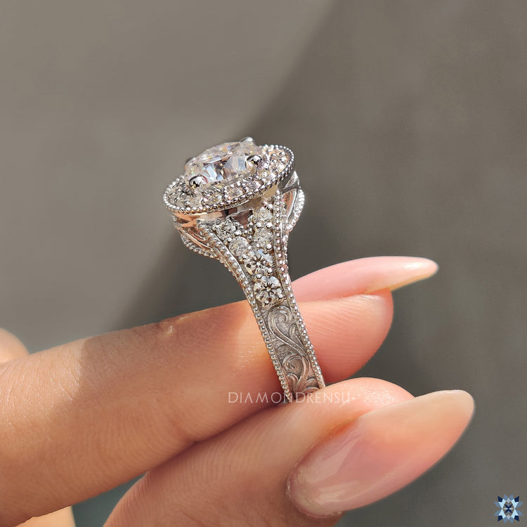 Milgrain engagement ring with a vintage touch and sparkling moissanite stone.
