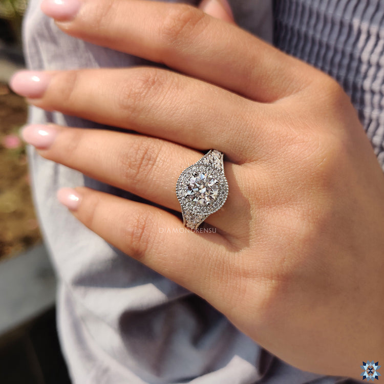 Elegant round moissanite ring in a vintage style, perfect for any engagement.
