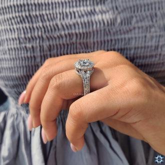 Halo engagement ring featuring a vintage moissanite stone surrounded by delicate accents.
