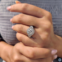 Classic white gold jewellery ring with a vintage moissanite design.
