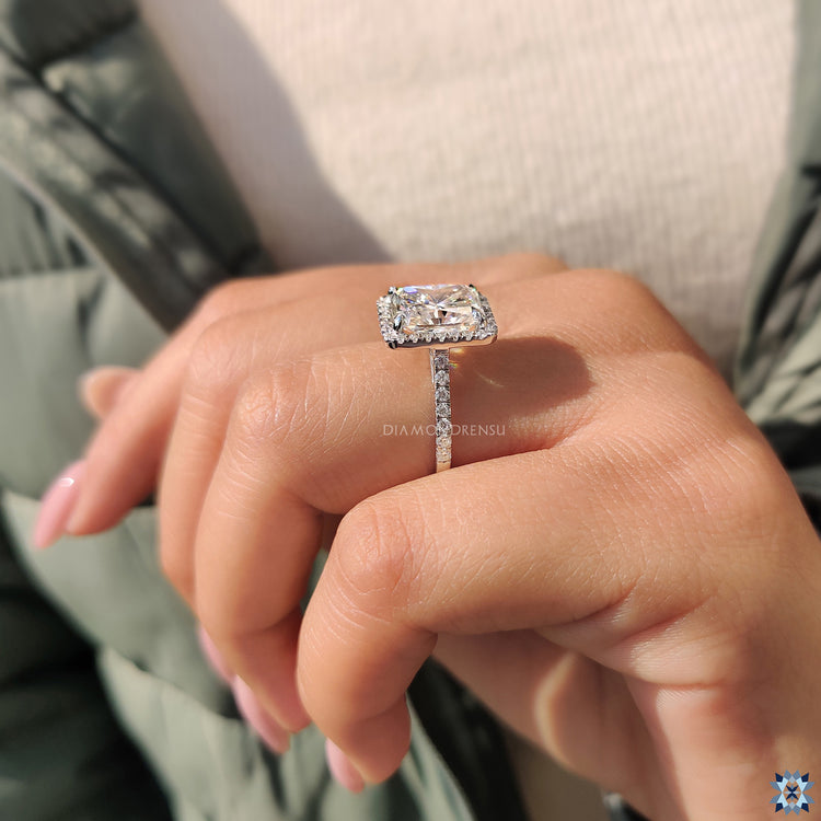 Round moissanite ring set in white gold for a modern and sleek look.
