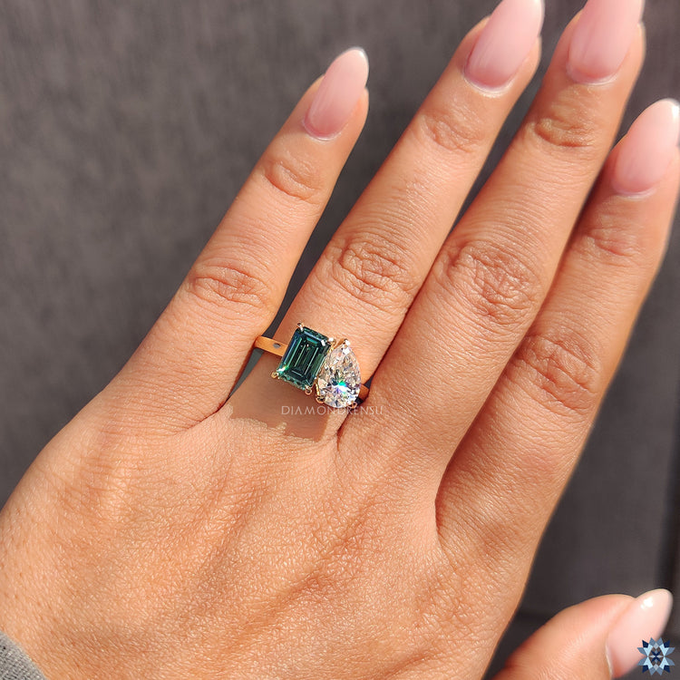 Handmade jewelry with green moissanite emerald cut and pear cut
