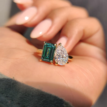 Toi et Moi engagement ring with pear and emerald cut design
