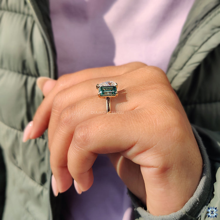 Green moissanite emerald cut ring with claw prongs setting
