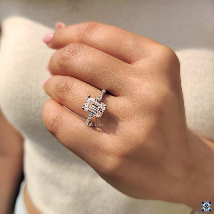 Moissanite emerald cut ring set in white gold for a sophisticated look.
