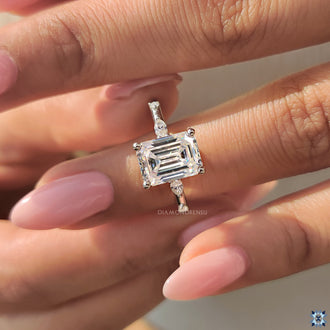 Handmade ring with an emerald cut moissanite stone in a beautiful setting.
