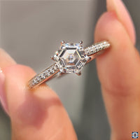 6 prong engagement ring with a hexagon  moissanite for secure brilliance.
