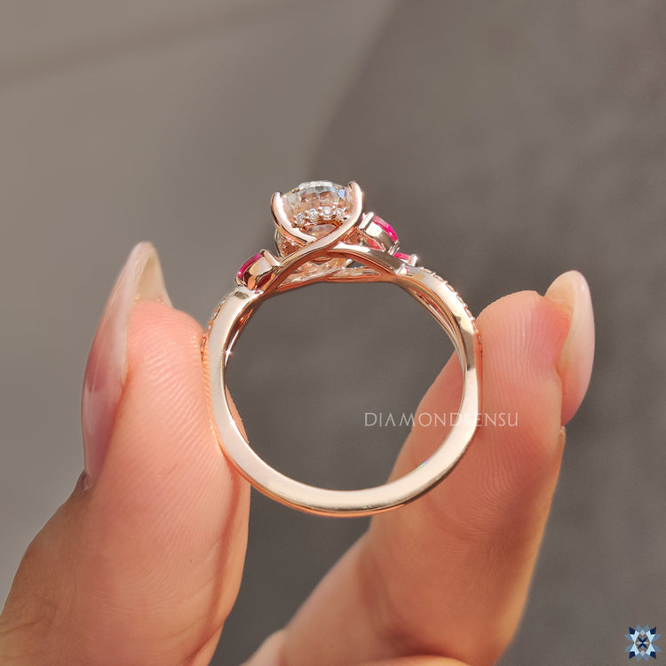 Side stone ring with moissanite centrepiece.
