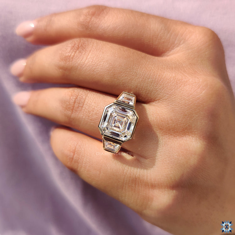 Trapezoid cut ring with asscher cut center stone for a modern look.
