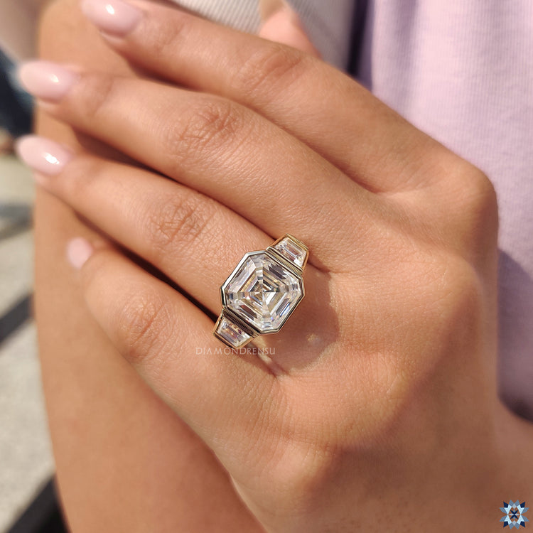 Tapered shank ring featuring an asscher cut diamond for a sleek design.
