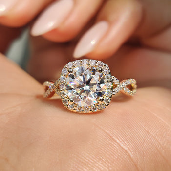 Round halo engagement ring with delicate moissanite accents
